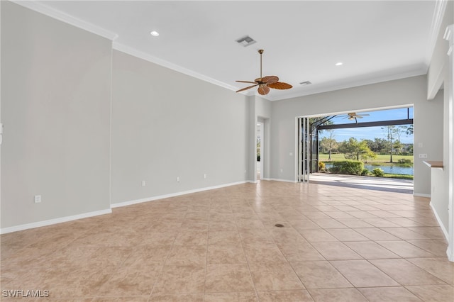 empty room featuring light tile patterned flooring, a water view, and ornamental molding