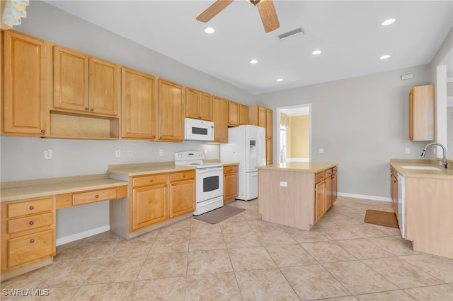 kitchen with white appliances, ceiling fan, sink, a center island, and light tile patterned flooring