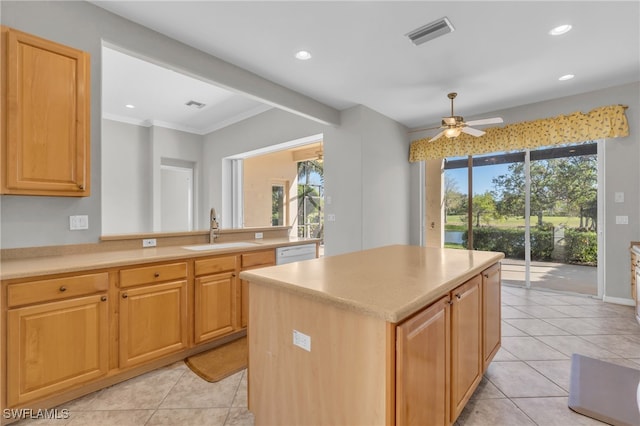 kitchen featuring a kitchen island, a wealth of natural light, crown molding, and sink