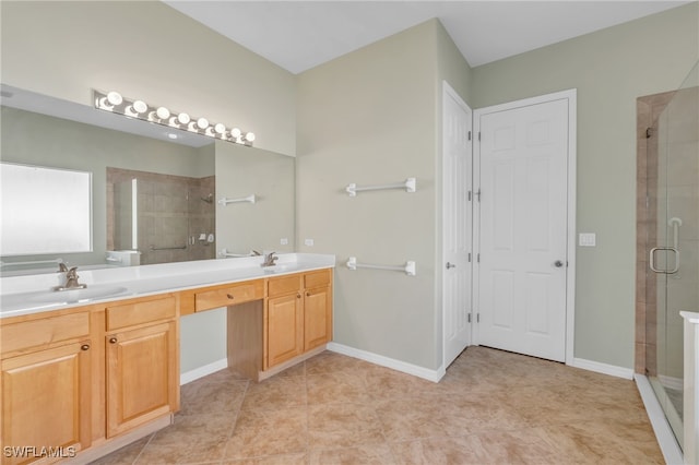 bathroom with tile patterned flooring, vanity, and an enclosed shower