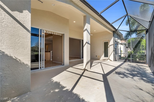 view of patio / terrace with glass enclosure