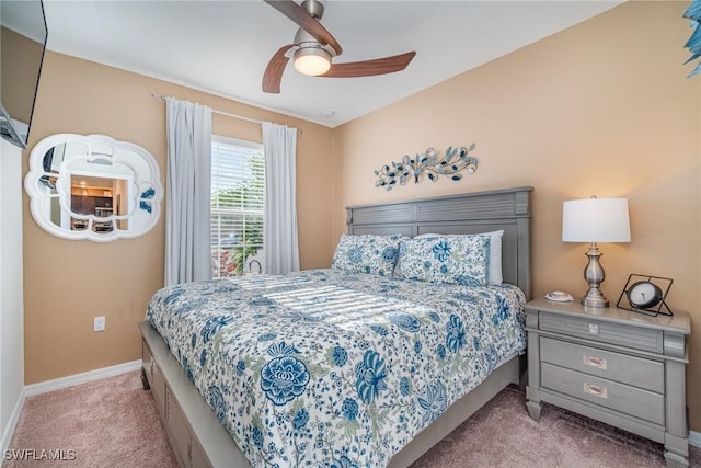 carpeted bedroom featuring a ceiling fan and baseboards