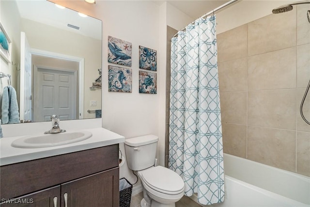 bathroom featuring shower / bath combo, vanity, and toilet