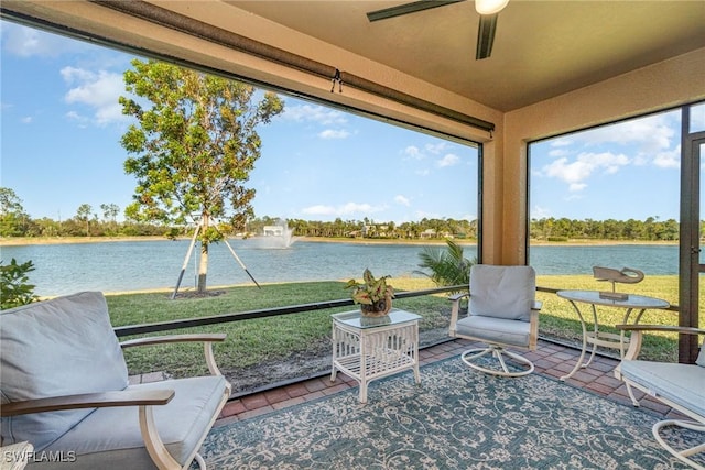 sunroom / solarium featuring a healthy amount of sunlight and a water view