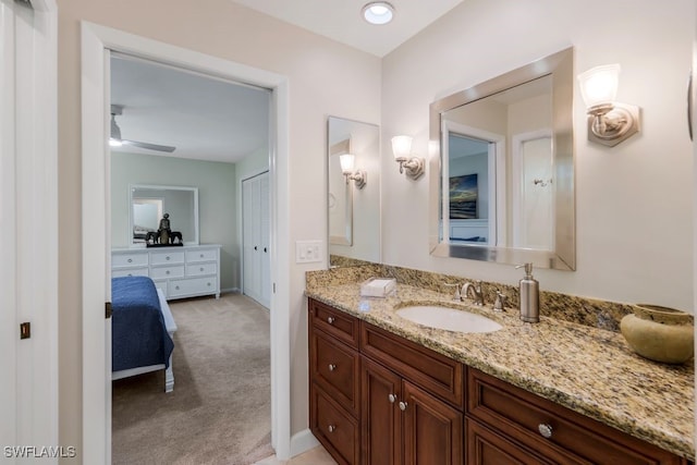 bathroom featuring ceiling fan and vanity