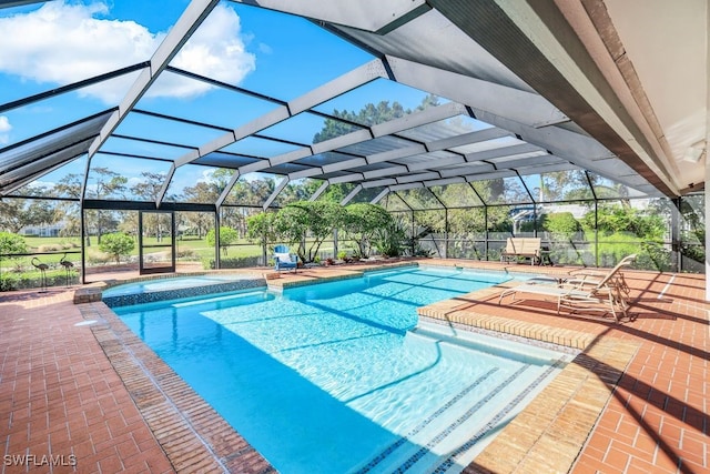 view of swimming pool with a lanai and a patio area