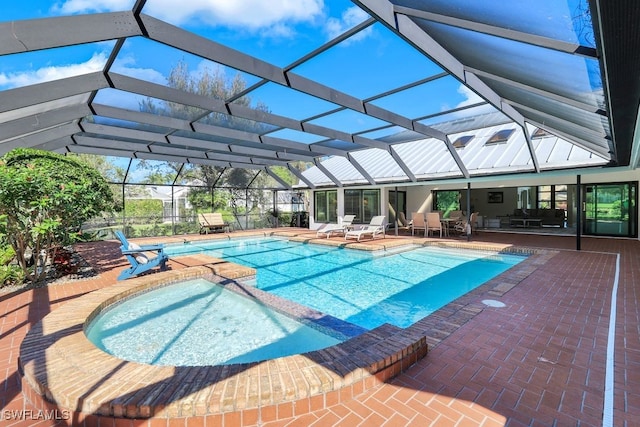 view of pool with a lanai and a patio area