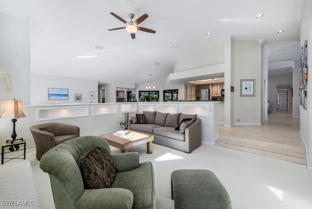 living room featuring ceiling fan, light tile patterned floors, and vaulted ceiling