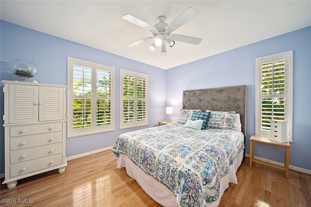 bedroom featuring ceiling fan and light hardwood / wood-style floors