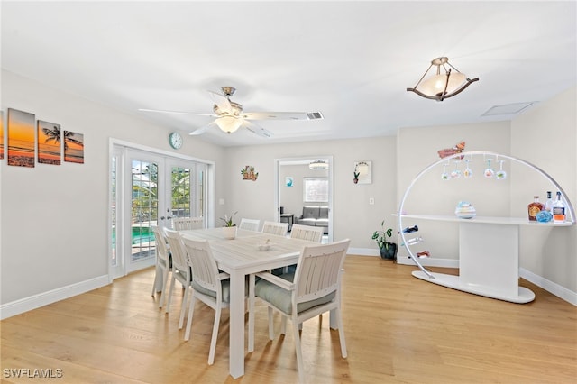 dining space featuring ceiling fan, french doors, and light hardwood / wood-style floors