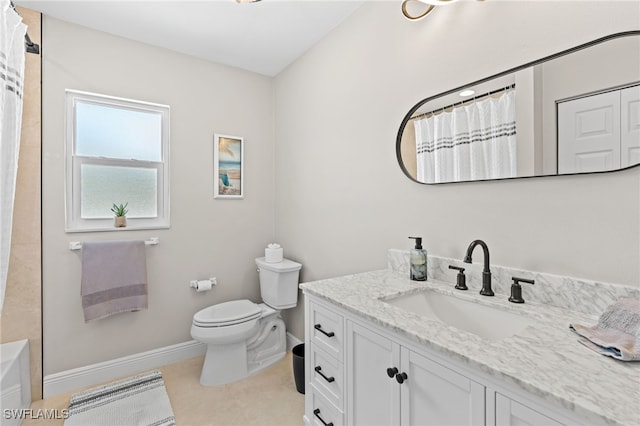 bathroom with tile patterned floors, vanity, and toilet