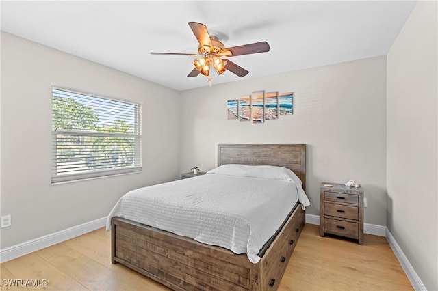 bedroom featuring light hardwood / wood-style flooring and ceiling fan