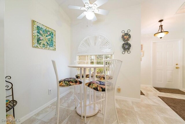 dining room featuring ceiling fan