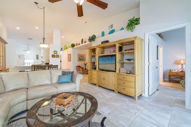 living room featuring a towering ceiling