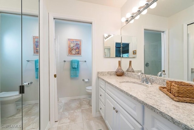 full bath with marble finish floor, toilet, vanity, and baseboards