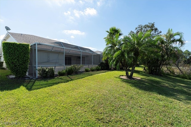 view of yard with a lanai