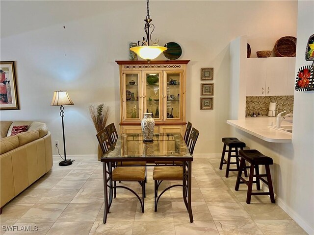 dining space with sink