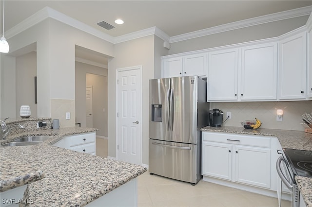 kitchen with light stone counters, stainless steel appliances, a sink, visible vents, and white cabinetry