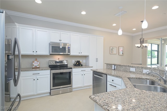 kitchen with crown molding, stainless steel appliances, visible vents, white cabinets, and a sink