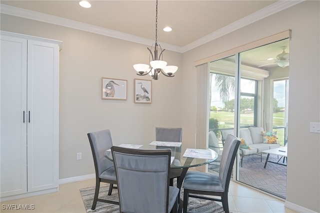 dining space with light tile patterned flooring, recessed lighting, ceiling fan with notable chandelier, baseboards, and ornamental molding