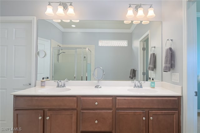 full bath with double vanity, ornamental molding, a stall shower, and a sink