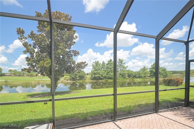 unfurnished sunroom with a water view and plenty of natural light