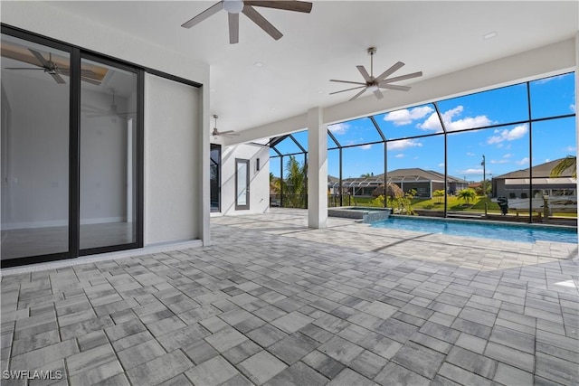 view of swimming pool with a lanai, a patio area, and ceiling fan