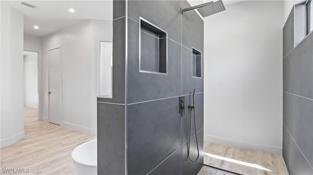 bathroom with wood-type flooring and a shower