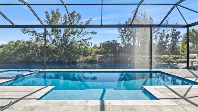 view of swimming pool featuring a patio and a lanai