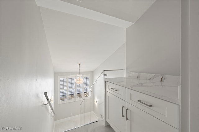 stairway featuring vaulted ceiling