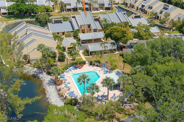 birds eye view of property with a water view