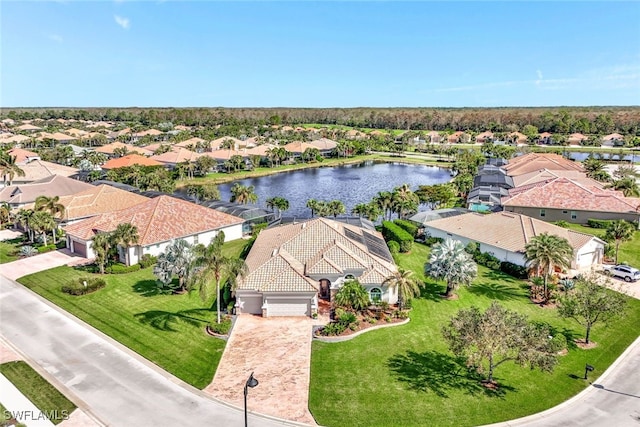 birds eye view of property with a water view