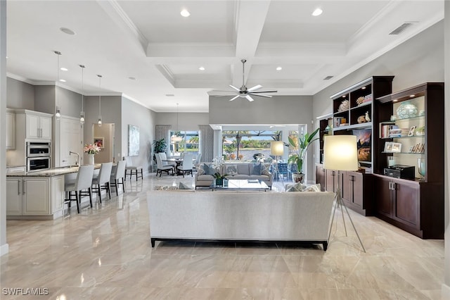 living room featuring beam ceiling, crown molding, ceiling fan, and coffered ceiling