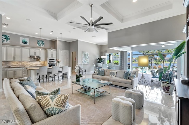 living room with ceiling fan, beam ceiling, crown molding, and coffered ceiling