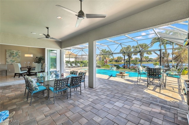 view of patio with ceiling fan and a lanai