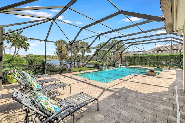 view of swimming pool featuring a patio and a lanai