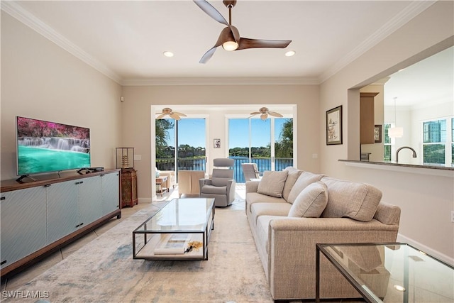 living room featuring a healthy amount of sunlight and ornamental molding