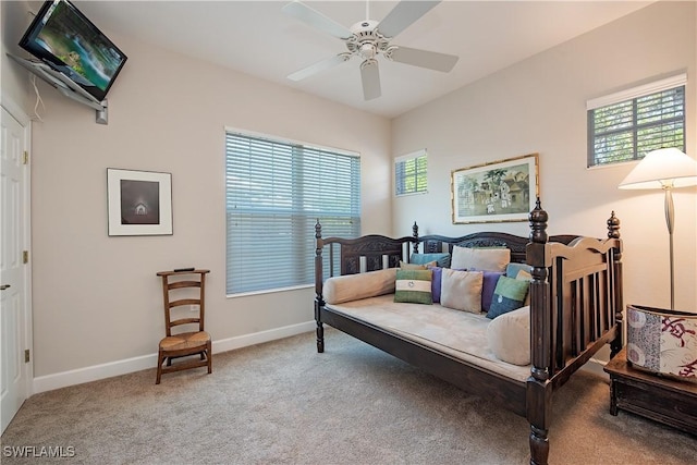 bedroom with carpet, ceiling fan, and multiple windows