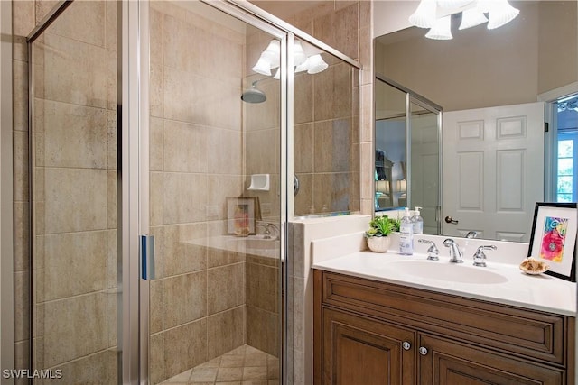 bathroom featuring vanity and a shower with door