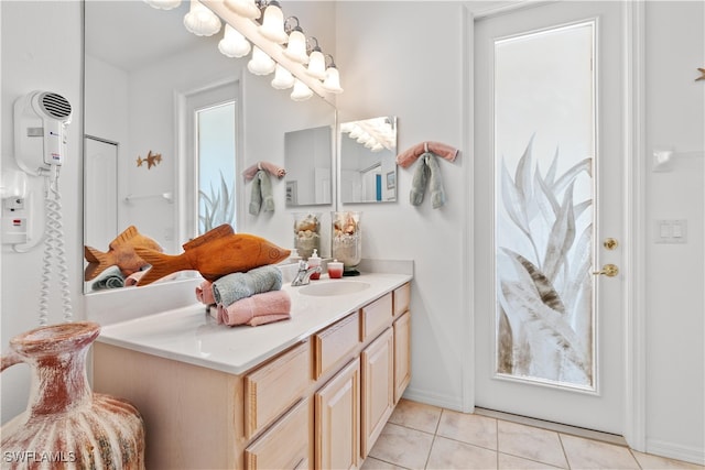 bathroom with tile patterned floors and vanity