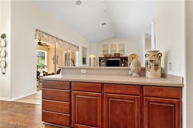 kitchen featuring hardwood / wood-style floors, ceiling fan, and lofted ceiling