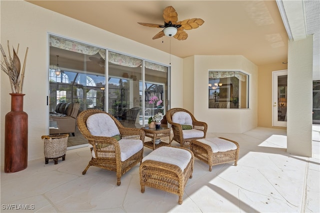 interior space with ceiling fan