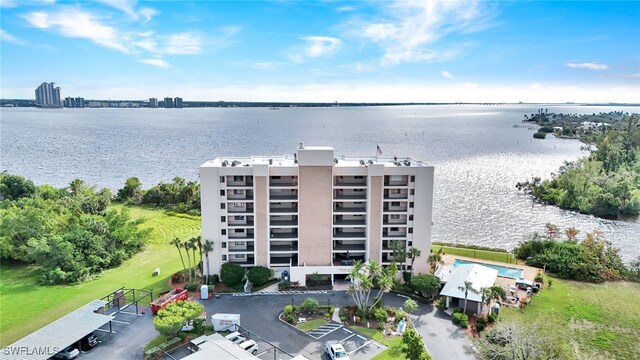 birds eye view of property with a water view