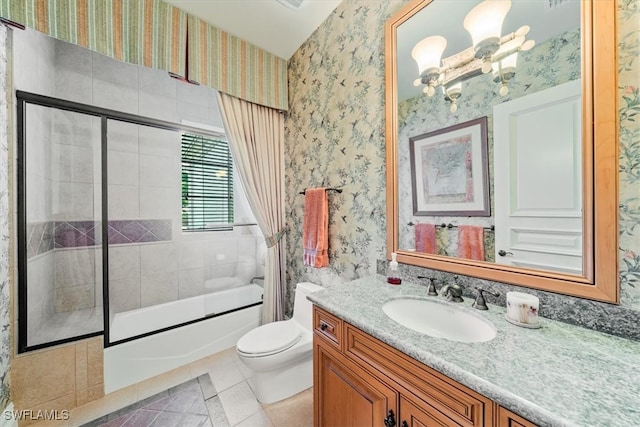 full bathroom featuring tile patterned flooring, vanity, enclosed tub / shower combo, and toilet