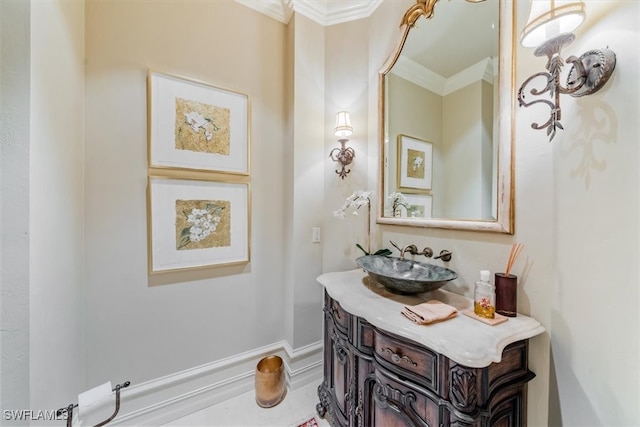 bathroom with vanity and ornamental molding