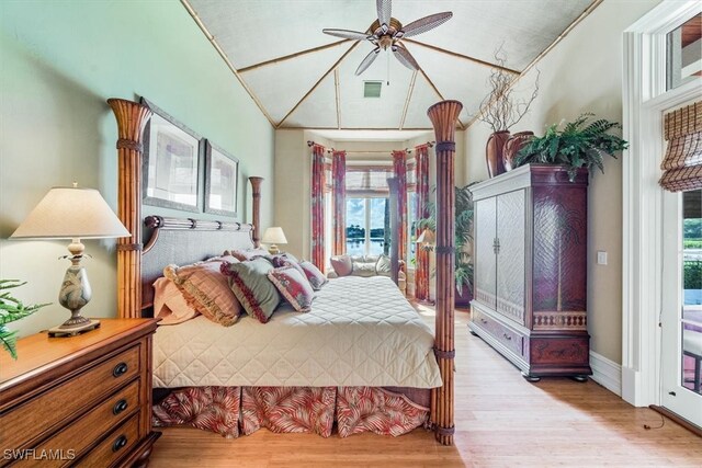 bedroom with ceiling fan, vaulted ceiling, and light hardwood / wood-style flooring