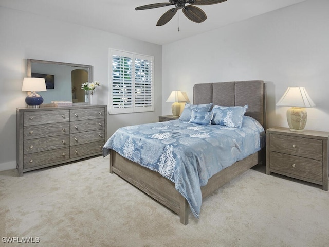 bedroom with ceiling fan and light carpet