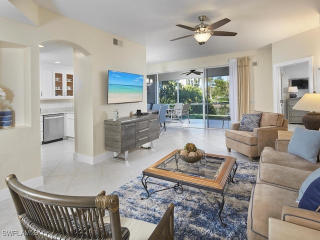 living room featuring ceiling fan and light tile patterned flooring