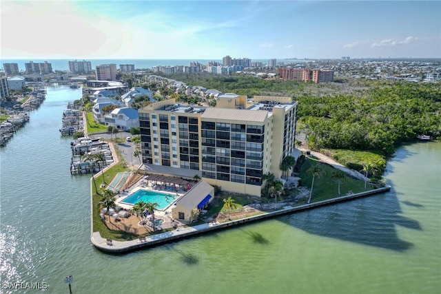 birds eye view of property featuring a water view and a view of city