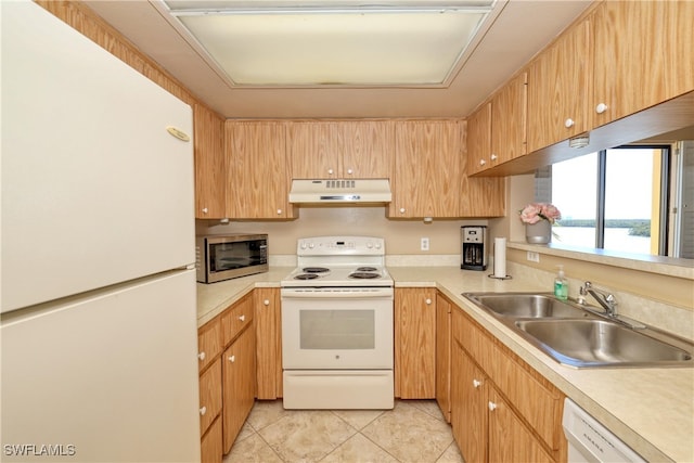 kitchen featuring sink, a water view, white appliances, and light tile patterned floors